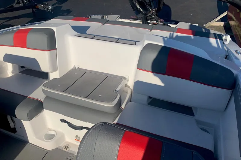 Slide: The Image of 2023 Tahoe T21 boat interior with red and gray seating, showcasing modern design. - 10