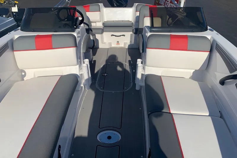 Slide: The Image of 2023 Tahoe T21 boat interior with gray and red seating, sleek design. - 5