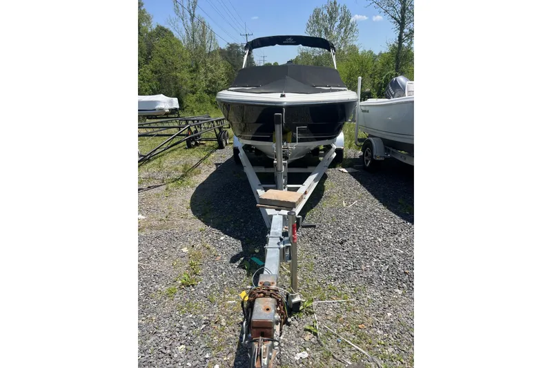 Slide: The Image of 2008 Monterey 180FS boat on trailer, parked outdoors on gravel. - 3