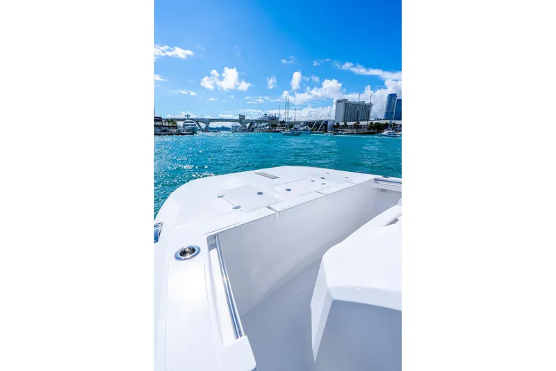 Slide: The Image of 2026 Hammer Yachts 35HH on clear blue water, city skyline in background. - 12