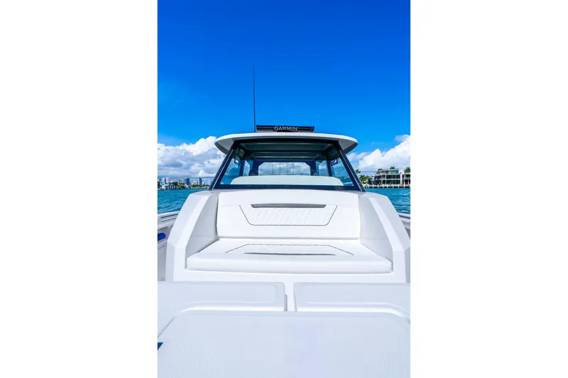 Slide: The Image of 2026 Hammer Yachts 35HH on water, showcasing sleek design and luxury seating. - 16