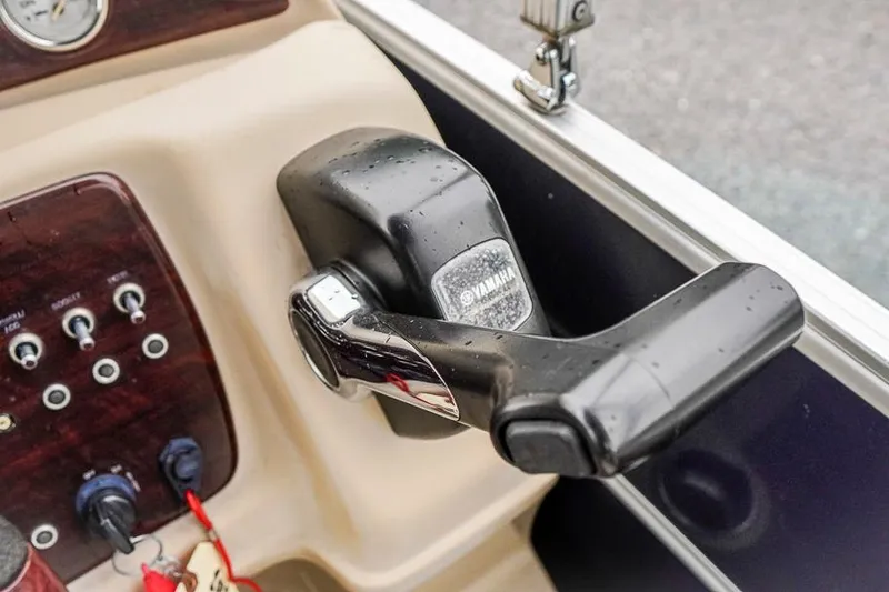 Slide: The Image of Close-up of Yamaha throttle control on 2012 Xcursion X21C boat dashboard. - 19