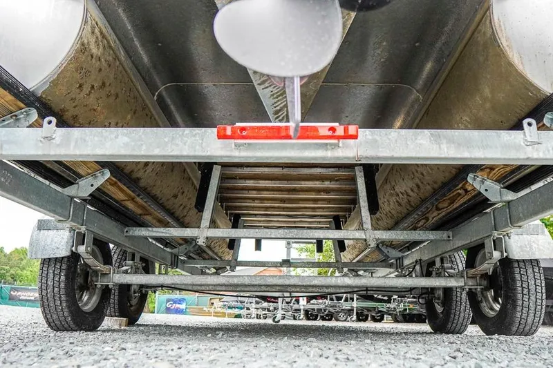 Slide: The Image of Underneath view of a 2012 Xcursion X21C pontoon boat on a trailer. - 30