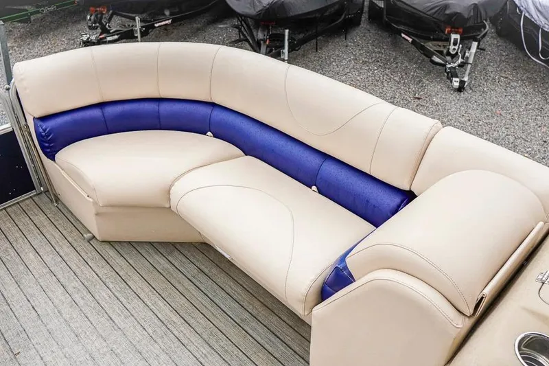 Slide: The Image of Luxurious seating on 2012 Xcursion X21C boat with beige and blue upholstery. - 8