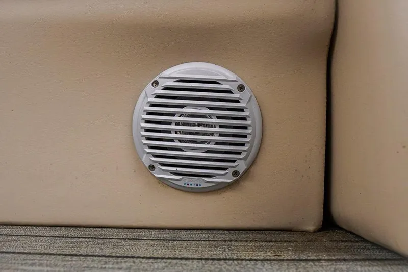 Slide: The Image of White speaker on beige surface of 2012 Xcursion X21C boat. - 9