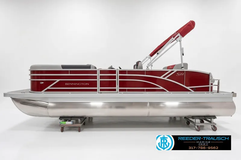 The Image of 2026 Bennington 22 SSB pontoon boat with red accents and canopy, side view. - 1