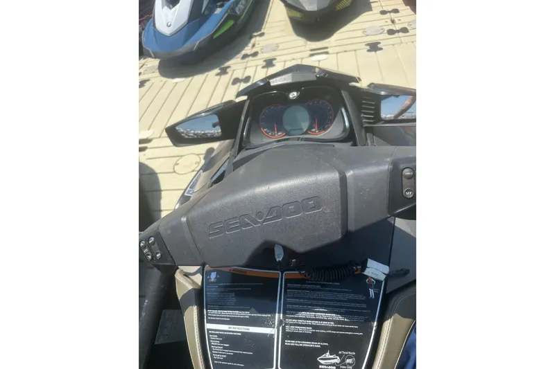 Slide: The Image of 2016 Sea-Doo GTX Limited 300 dashboard and controls on a docked jet ski. - 11