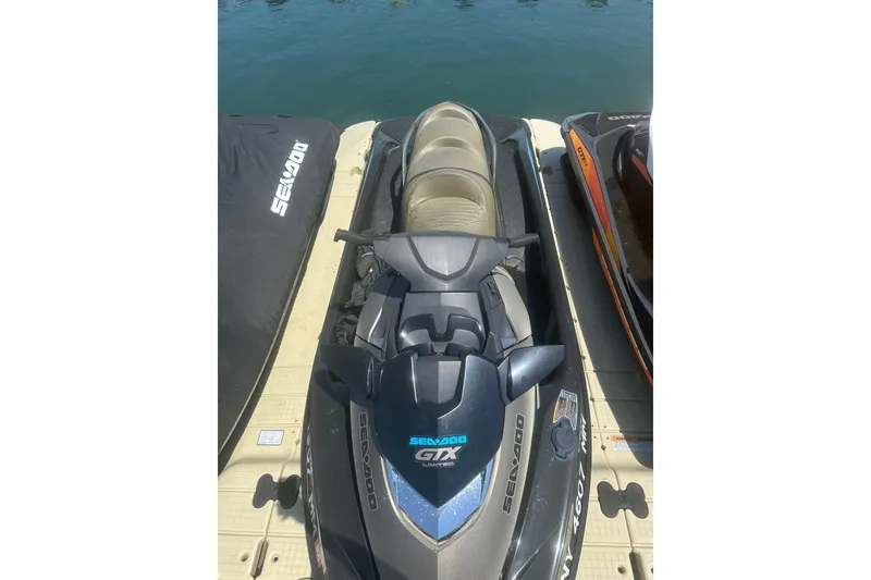 Slide: The Image of 2016 Sea-Doo GTX Limited 300 jet ski docked on water, top view. - 7
