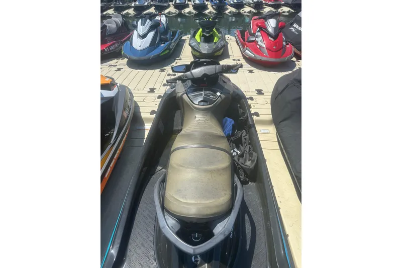 Slide: The Image of 2016 Sea-Doo GTX Limited 300 jet ski docked among other watercraft. - 9