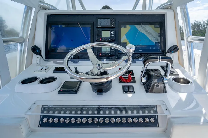 Slide: The Image of Helm of 2017 Invincible 39 Open Fisherman with dual displays and controls. - 3