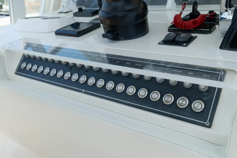 Slide: The Image of Control panel of a 2017 Invincible 39 Open Fisherman boat with multiple switches. - 30