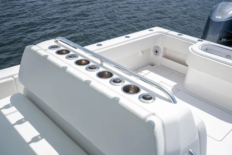 Slide: The Image of 2017 Invincible 39 Open Fisherman boat interior with rod holders and seating. - 32
