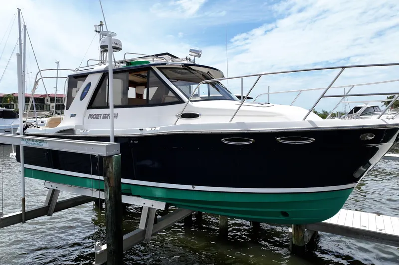The Image of 2012 Cutwater C-26 boat docked, featuring sleek design and modern amenities. - 0