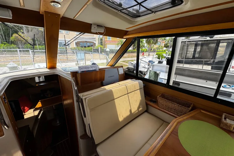 Slide: The Image of Interior of a 2012 Cutwater C-26 boat with seating and navigation equipment. - 14