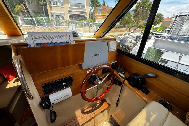 Slide: The Image of Interior helm of a 2012 Cutwater C-26 boat with Garmin navigation system. - 15