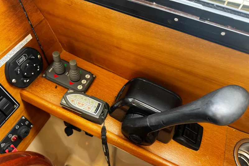 Slide: The Image of Control panel of a 2012 Cutwater C-26 boat with joystick and throttle. - 17
