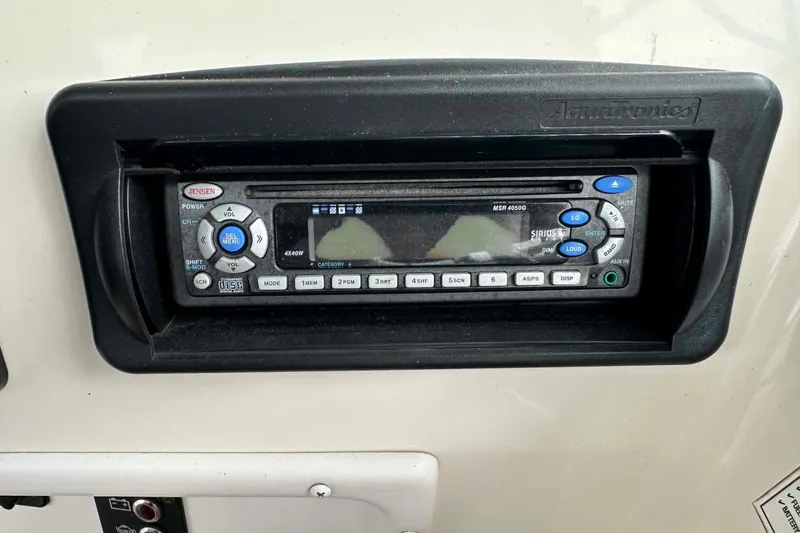 Slide: The Image of Jensen stereo system on 2006 Hurricane FunDeck GS 232 OB boat dashboard. - 11