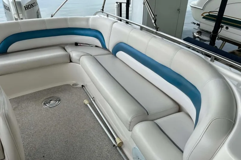 Slide: The Image of 2006 Hurricane FunDeck GS 232 OB boat interior with white and blue seating. - 15