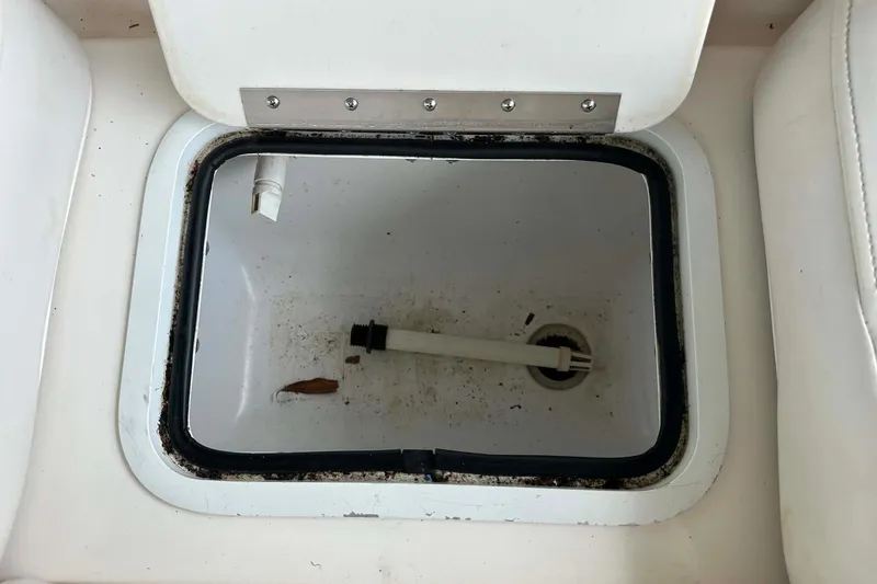 Slide: The Image of Open storage compartment on 2006 Hurricane FunDeck GS 232 OB boat. - 6