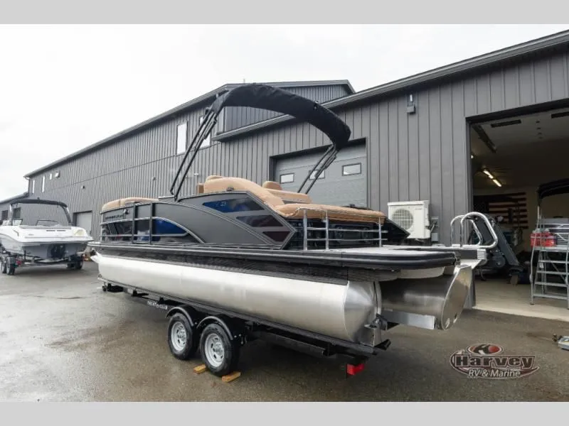 Slide: The Image of 2026 M Series 23 MSB pontoon boat in front of gray building. - 5