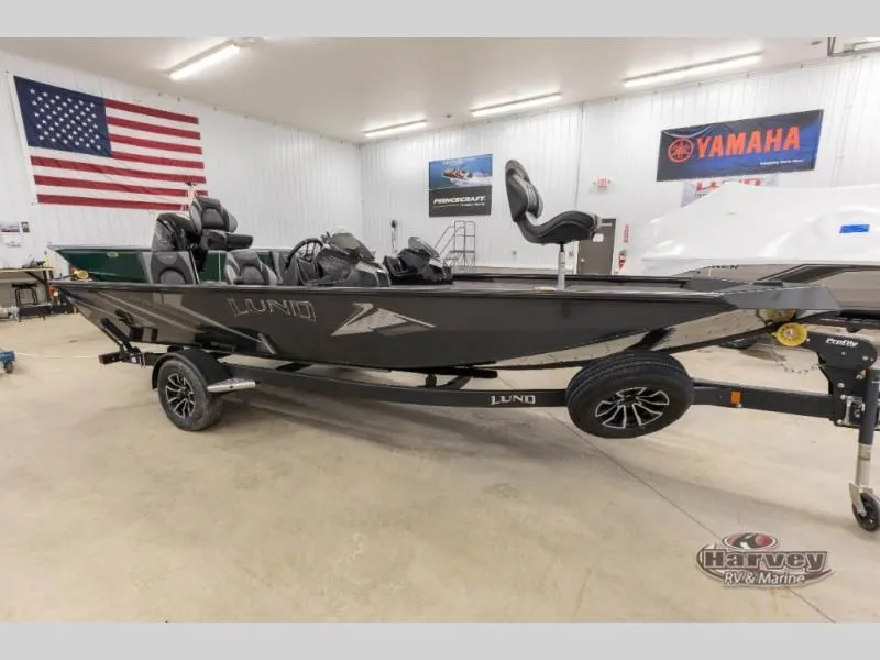 The Image of Renegade 1875 SS 2026 boat in a workshop with American flag. - 1