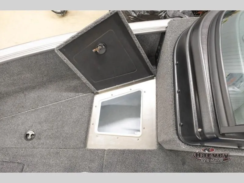 Slide: The Image of 2026 Impact XS 1775 Sport boat with storage compartment and carpeted floor. - 21