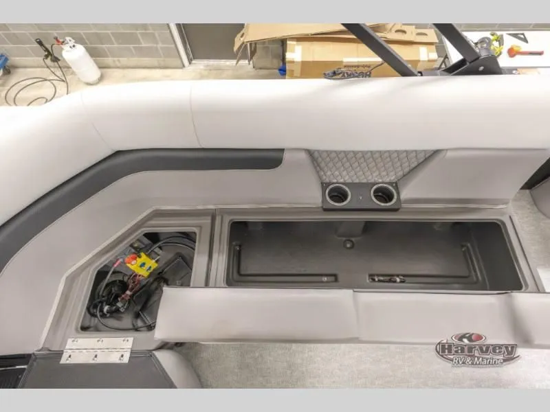 Slide: The Image of Interior of 2026 Vectra Classic 23 QL with storage and cup holders. - 14