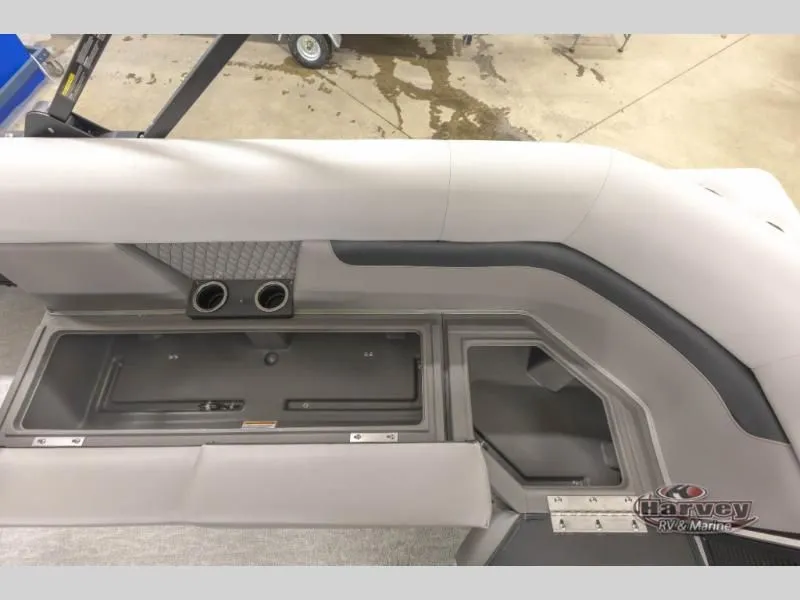 Slide: The Image of Interior of Vectra Classic 23 QL 2026 with storage and cup holders. - 16