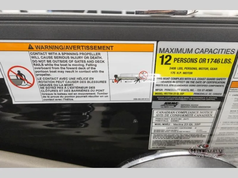 Slide: The Image of Warning label on Vectra Classic 23 QL boat, maximum capacity 12 persons. - 21