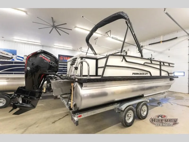 Slide: The Image of 2026 Vectra Speed 21L pontoon boat in a garage on a trailer. - 5