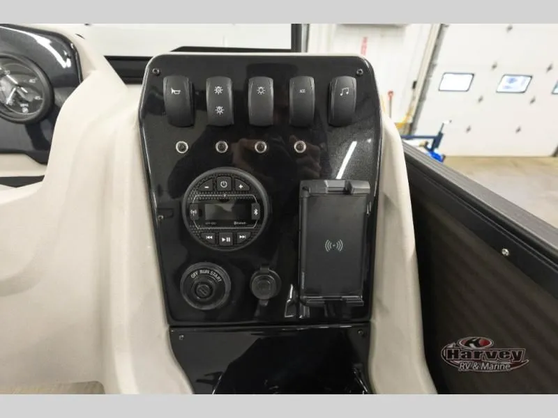 Slide: The Image of Dashboard of 2026 Sportfisher Sport 23-2RS with controls and charger. - 25