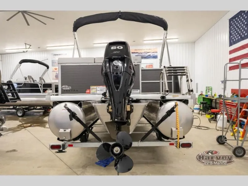 Slide: The Image of Rear view of a 2026 Vectra Classic 19 L boat in a workshop. - 6