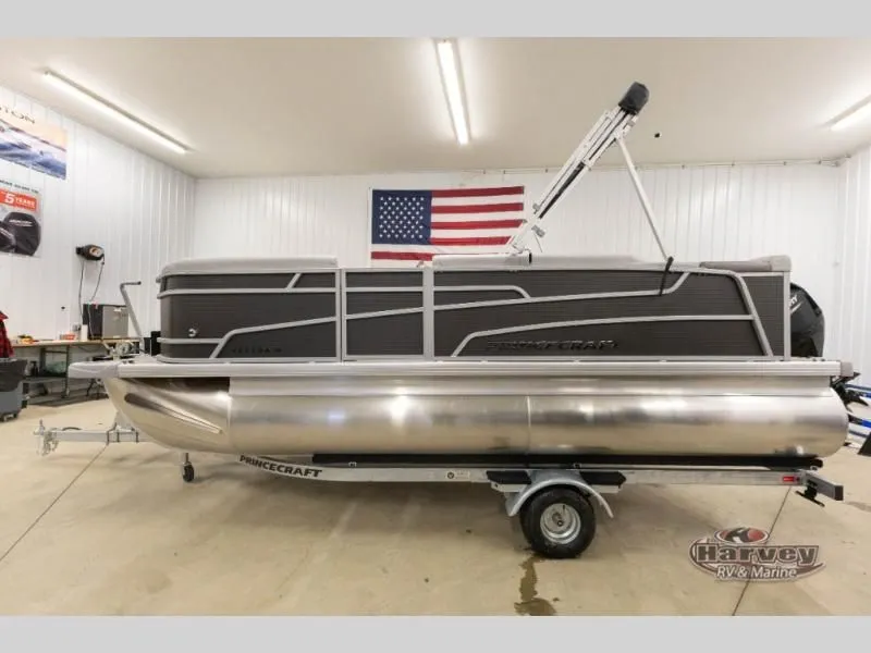 Slide: The Image of 2026 Vectra Classic 19 L pontoon boat in a garage. - 7