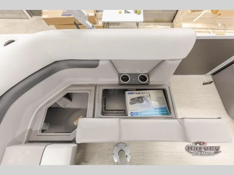 Slide: The Image of Interior of Sportfisher Classic 21-2RS 2026 with storage and cup holders. - 14