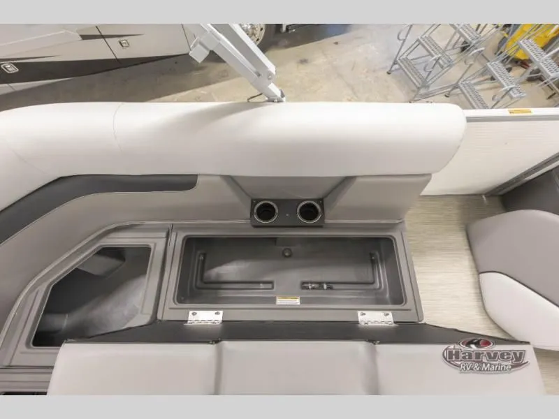 Slide: The Image of Interior of 2026 Vectra Classic 19 L with storage and cup holders. - 14