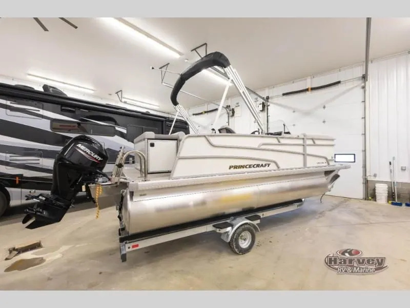 Slide: The Image of 2026 Vectra Classic 19 L pontoon boat in a garage. - 7