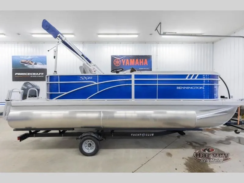 The Image of 2026 Bennington SX Series 20 pontoon boat in a showroom. - 1