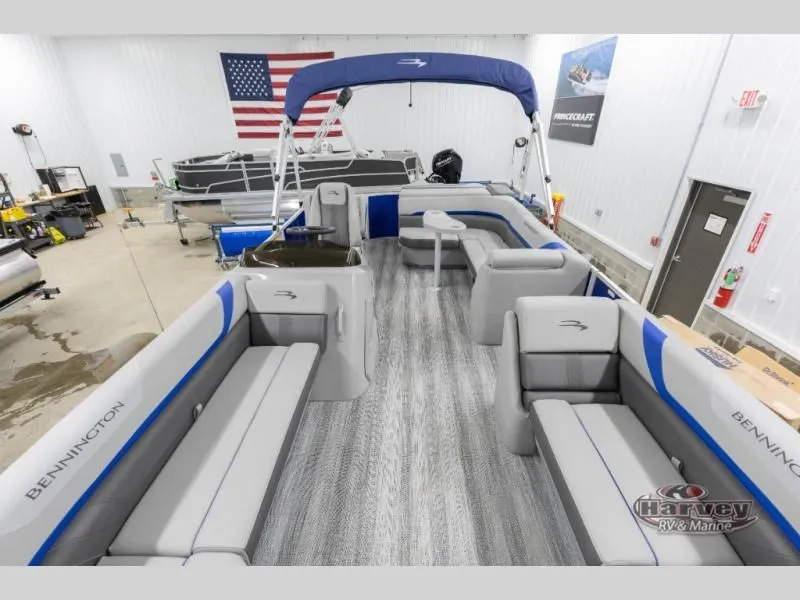 Slide: The Image of Interior view of a 2026 Bennington pontoon boat in showroom. - 10