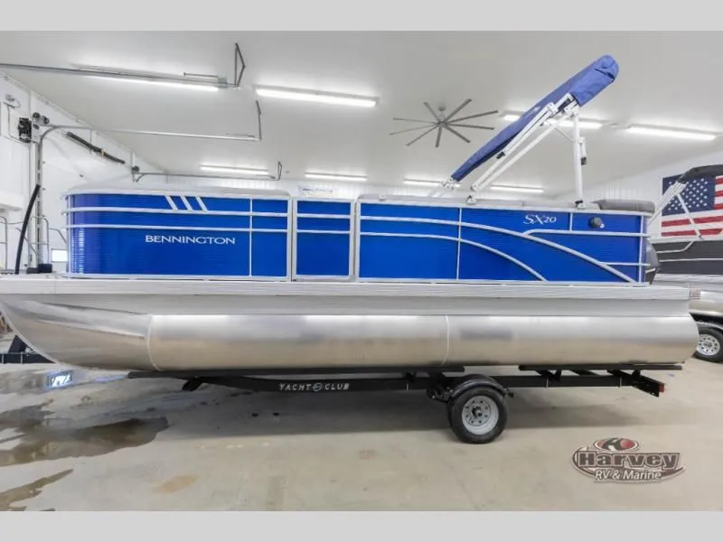 Slide: The Image of 2026 Bennington SX Series 20 pontoon boat in a garage. - 6