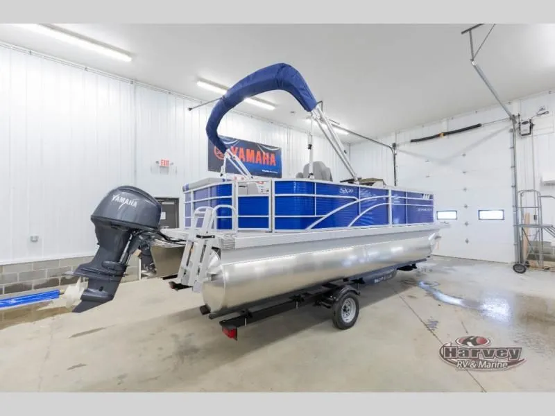 Slide: The Image of 2026 SX Series 20 SXLG pontoon boat in a garage. - 9