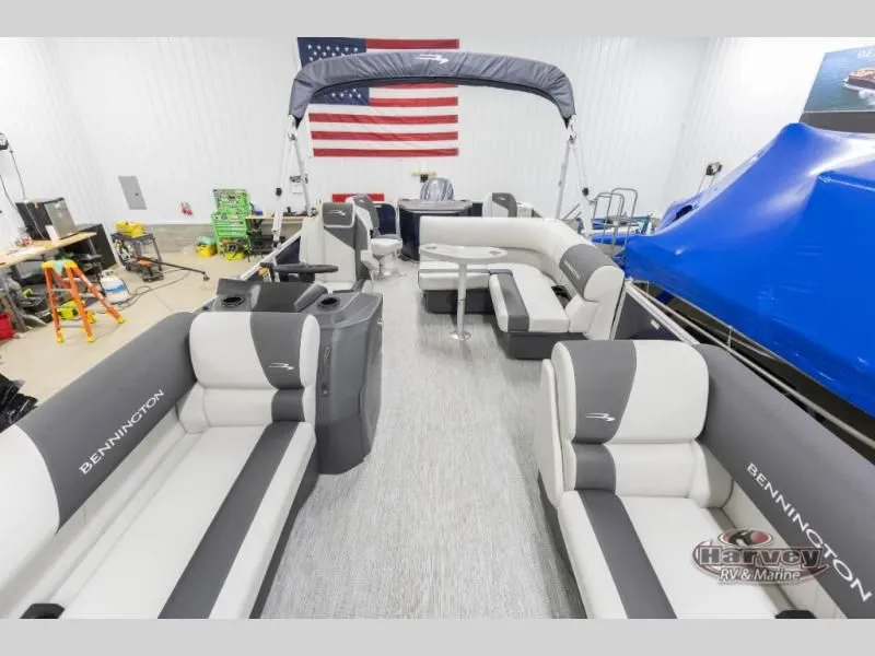 Slide: The Image of Interior view of a 2026 Bennington pontoon boat with gray seating. - 7
