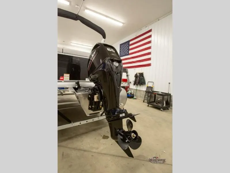 Slide: The Image of Boat motor in workshop with American flag, Vectra Classic 19 L, 2026. - 5