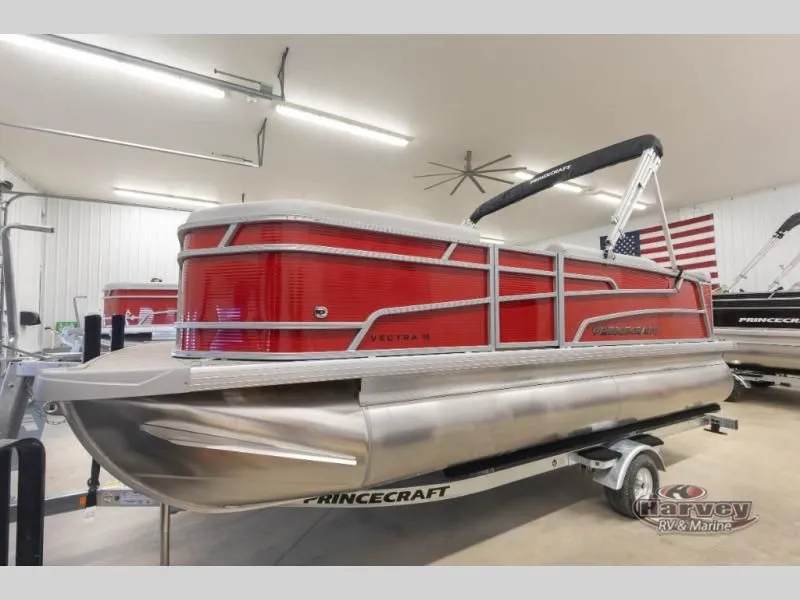Slide: The Image of Red Vectra Classic 19 L pontoon boat, 2026 model, in a garage. - 9