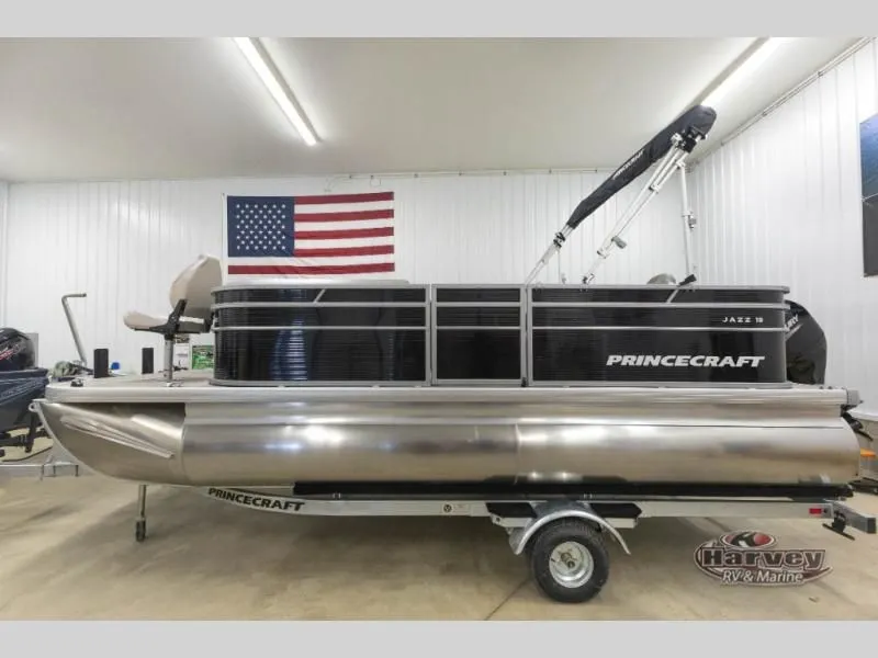 Slide: The Image of 2026 Jazz 19-4S pontoon boat in a workshop with US flag. - 4