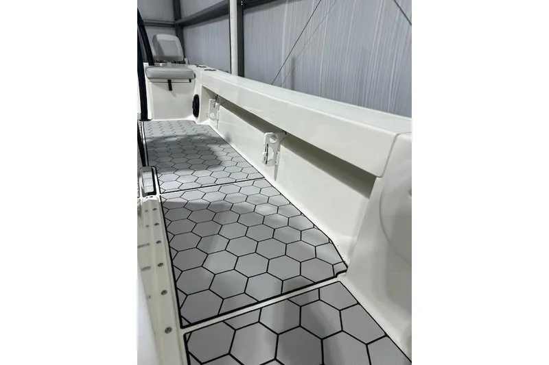 Slide: The Image of 2020 KenCraft 239 Bay Rider boat interior with hexagonal patterned flooring. - 13