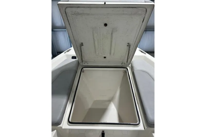 Slide: The Image of Open storage compartment on a 2020 KenCraft 239 Bay Rider boat. - 20