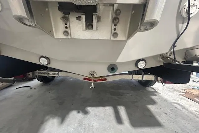 Slide: The Image of 2020 KenCraft 239 Bay Rider boat underside view, showcasing trailer and hull details. - 4