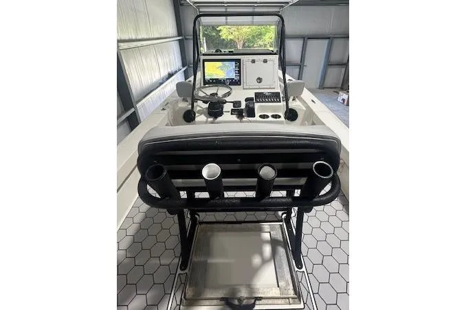 Slide: The Image of 2020 KenCraft 239 Bay Rider boat console with navigation equipment in a storage area. - 7