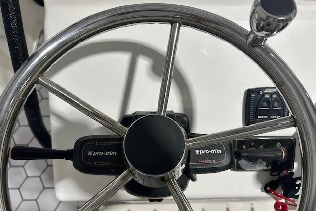 Slide: The Image of Steering wheel of 2020 KenCraft 239 Bay Rider boat with Pro-Trim controls. - 9