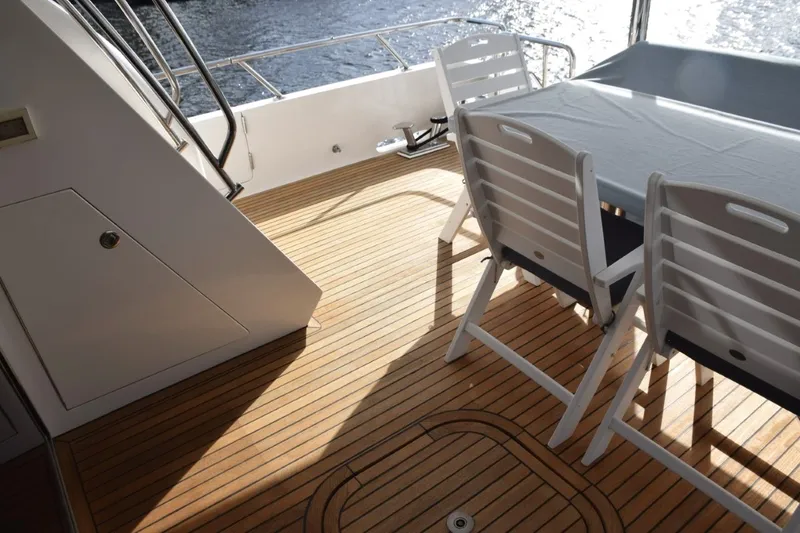 Slide: The Image of Teak deck of 2013 Hargrave 76 Open Bridge yacht with outdoor seating. - 45